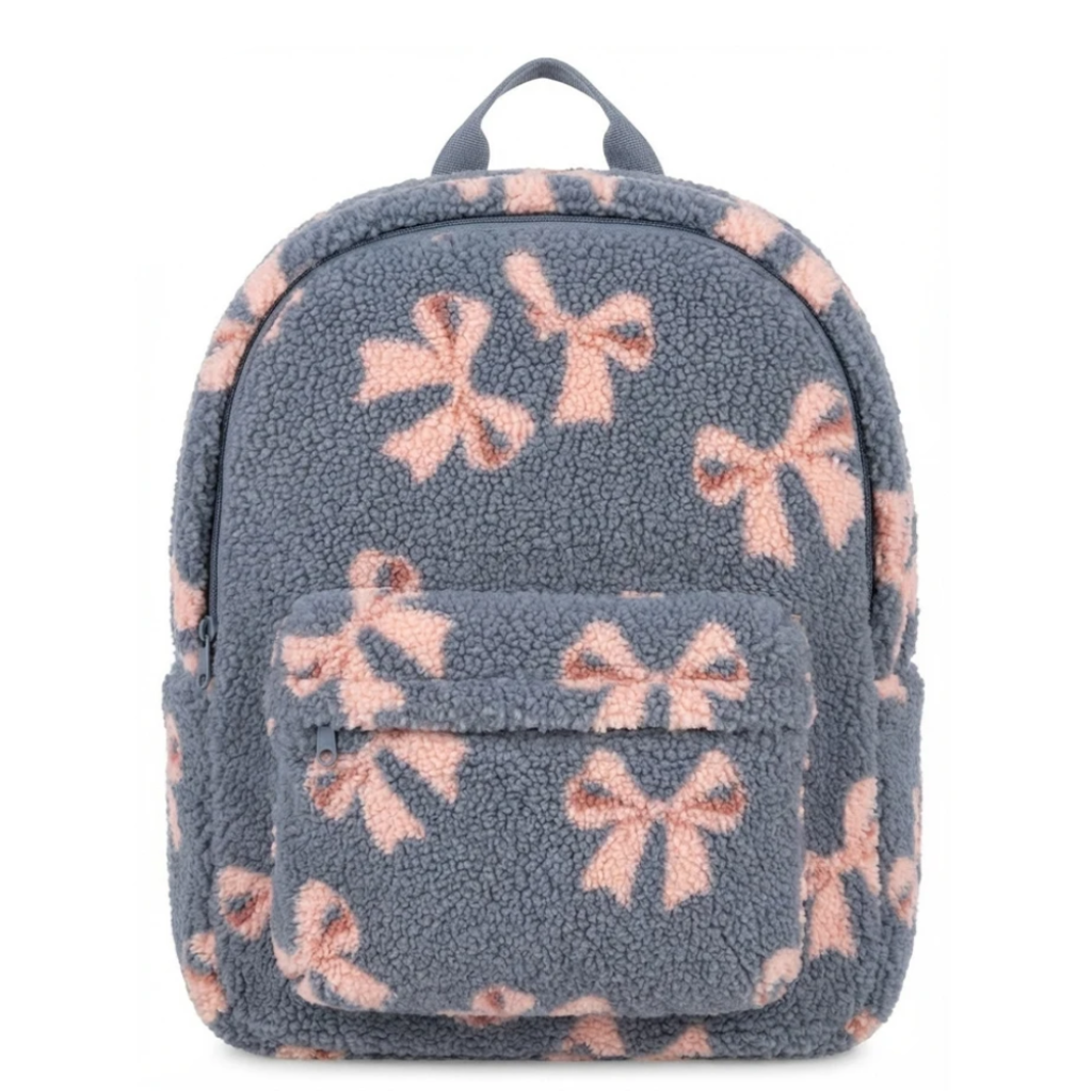 Front view of the blue teddy backpack with pink ribbons and a zippered front pocket