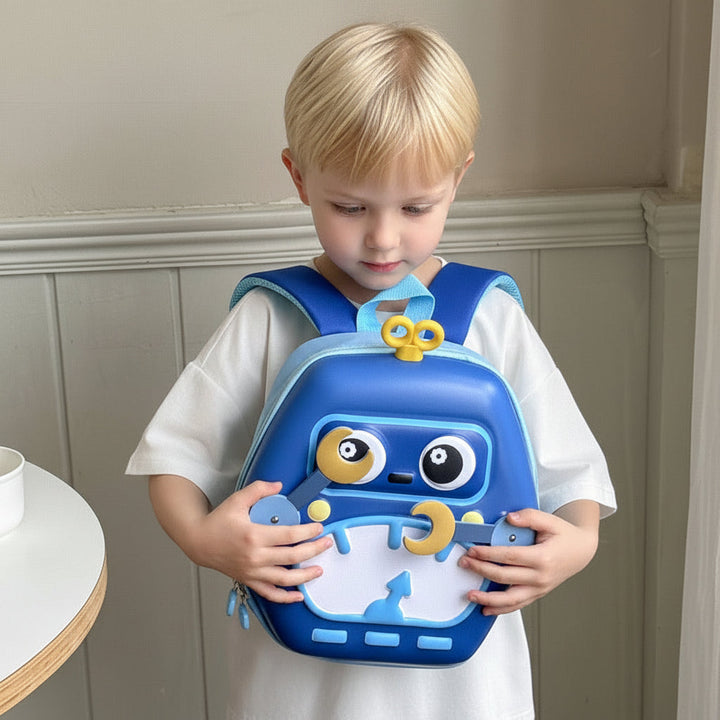 Child wearing a blue robot backpack on the front