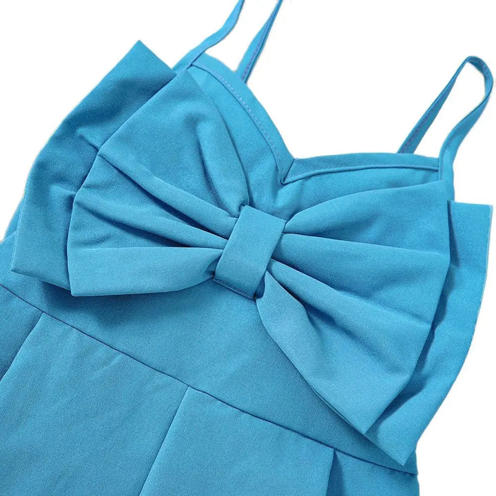 Blue romper detail showing the large front bow, neckline and slim straps