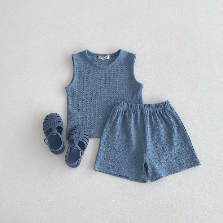 Blue cotton outfit with a sleeveless round-neck top and elastic-waist shorts.