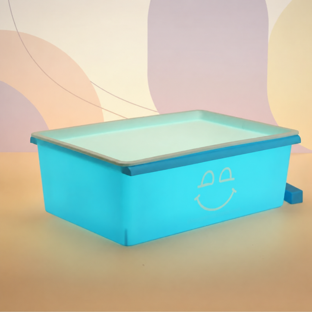 Blue sand drawing board with a pale drawing surface and smile design on the front