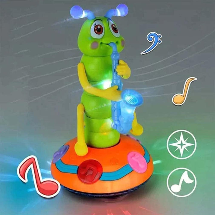 Green caterpillar toy with a blue saxophone, glowing antennae and colored light around its base