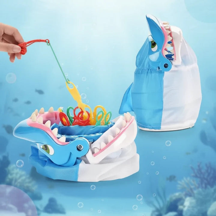 Blue shark fishing game shown open and upright, with a rod lifting a yellow sea creature.
