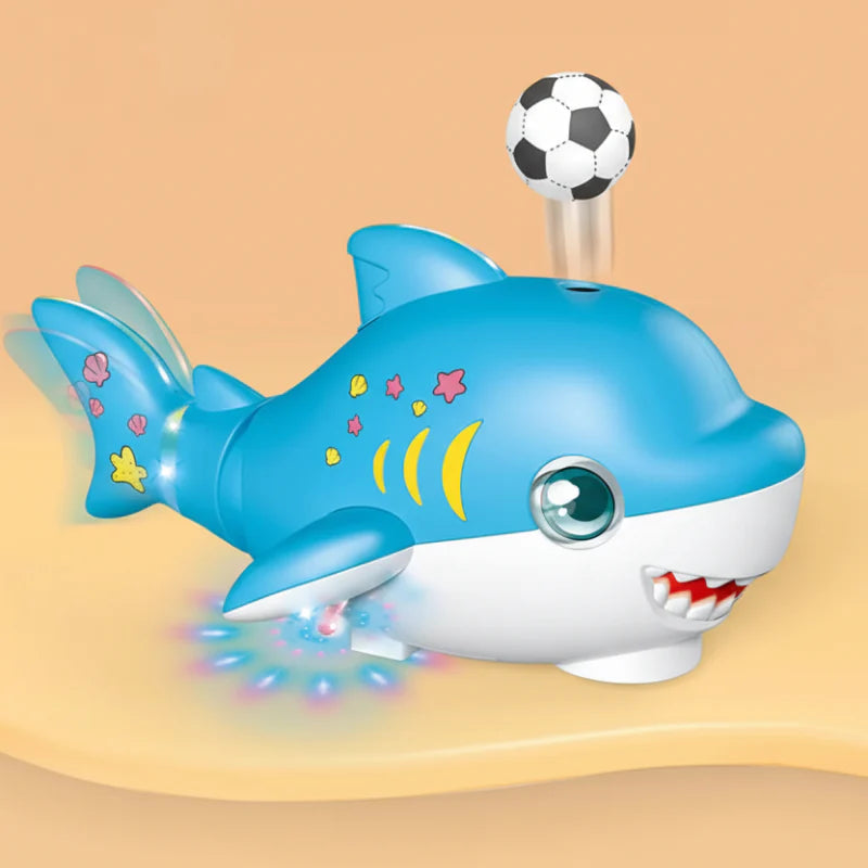 Blue shark toy with a soccer-style ball floating above its back and lights beneath its fins