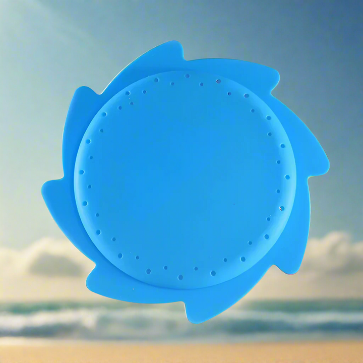 Plain blue silicone water flying disc with small holes around its center