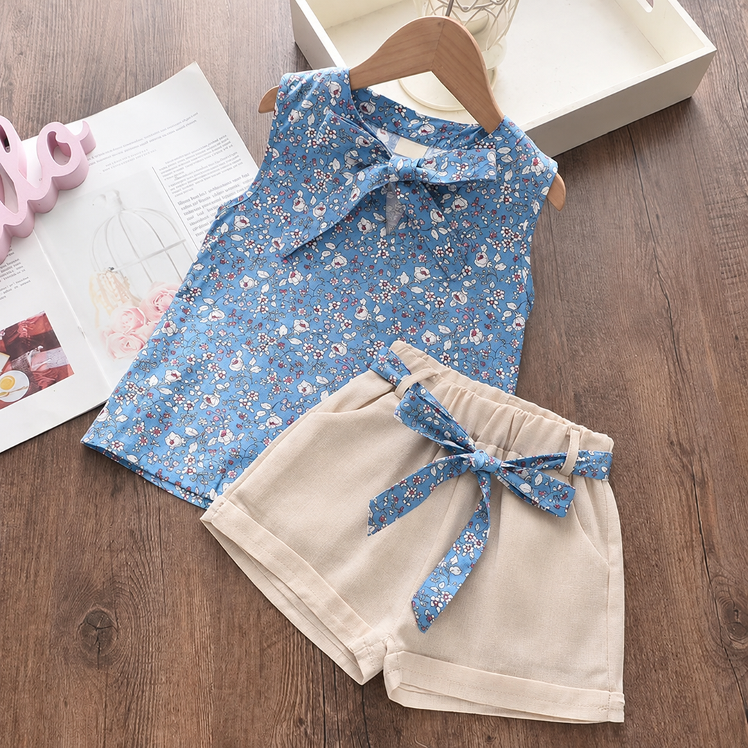 Blue floral top and cuffed beige shorts with a coordinating blue floral waist tie