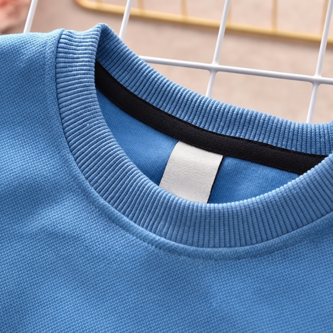 Close-up of the ribbed crew neckline on the blue sweatshirt