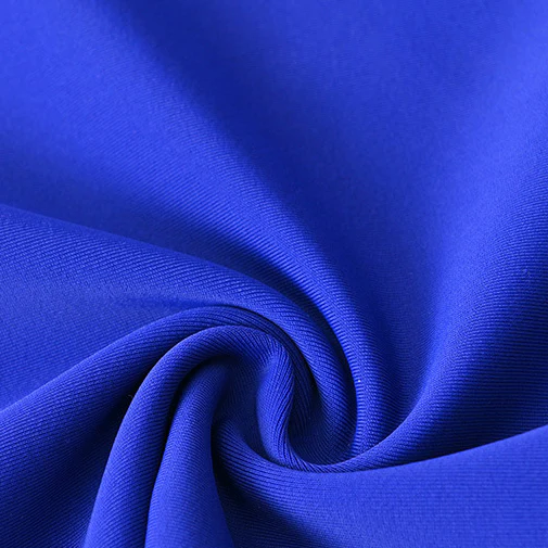 Close-up of blue swimwear fabric folded into a swirl