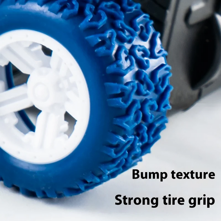 Close-up of a blue toy tank tire with raised tread and a white wheel