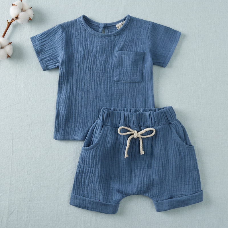 Blue textured cotton T-shirt and matching shorts with an elastic waistband and front tie.