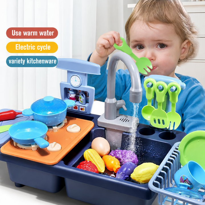 Child playing with a blue toy kitchen, running faucet, and pretend food