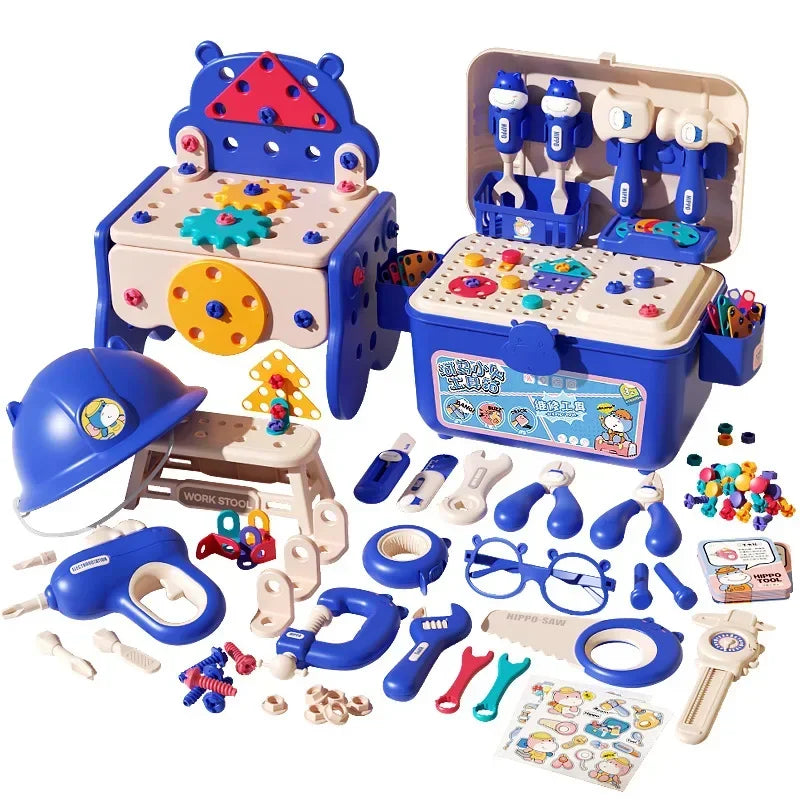 Blue toolbox and small workbench displayed with toy tools, building pieces, and pretend construction accessories