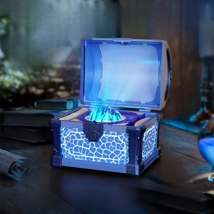 Open blue treasure-chest night light with a glowing projector on a tabletop