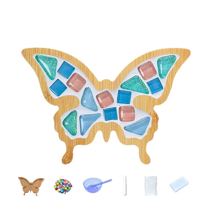 Blue, turquoise and pink butterfly mosaic coaster shown with crafting supplies