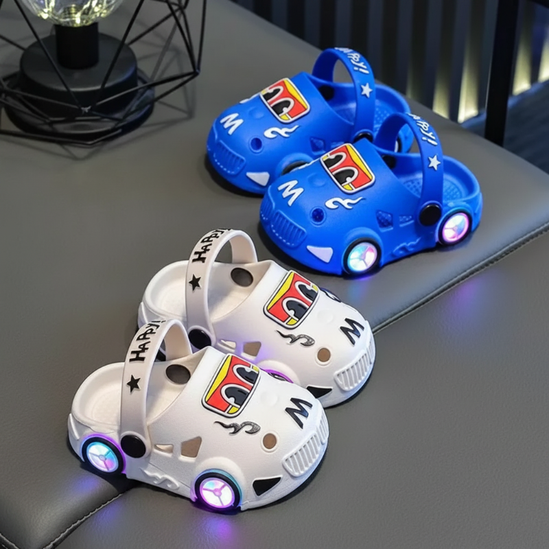 Blue and white car slipper pairs with glowing wheel-shaped lights on a bench.
