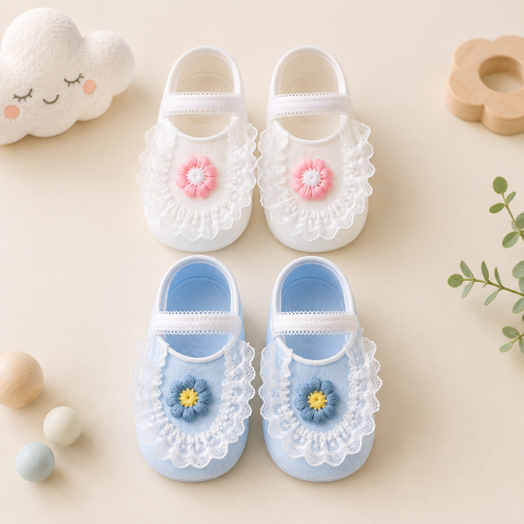 Two pairs of flower-and-lace baby socks in blue and white