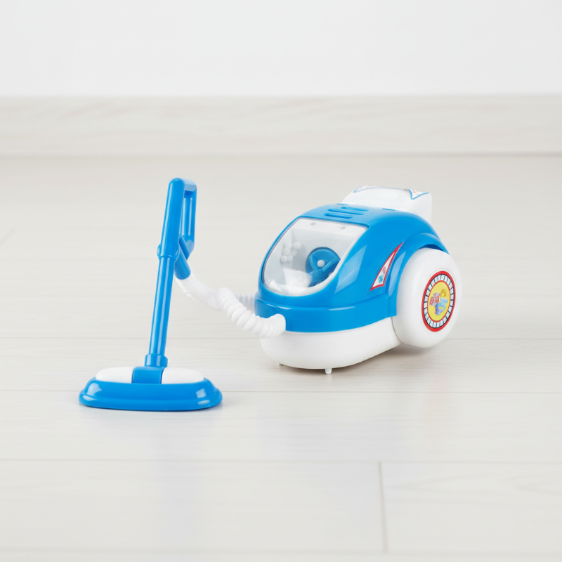 Blue and white toy canister vacuum with a hose and floor attachment