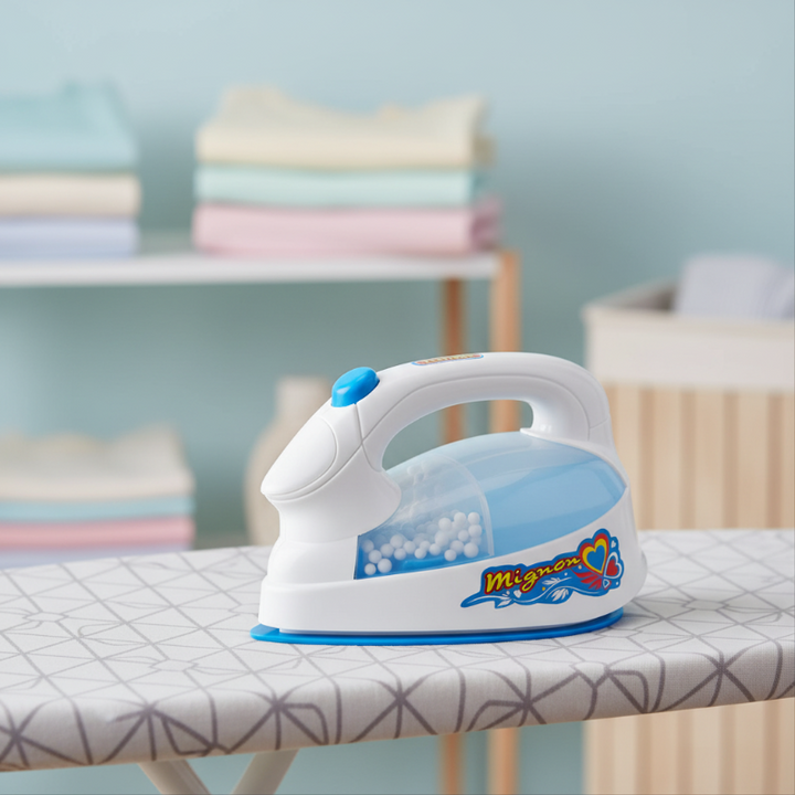 Blue and white toy iron with a clear side compartment and top handle