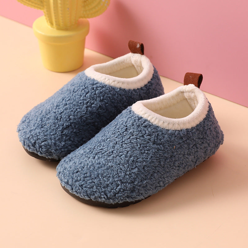 Blue wool slippers with cream-colored lining and brown heel pull tabs