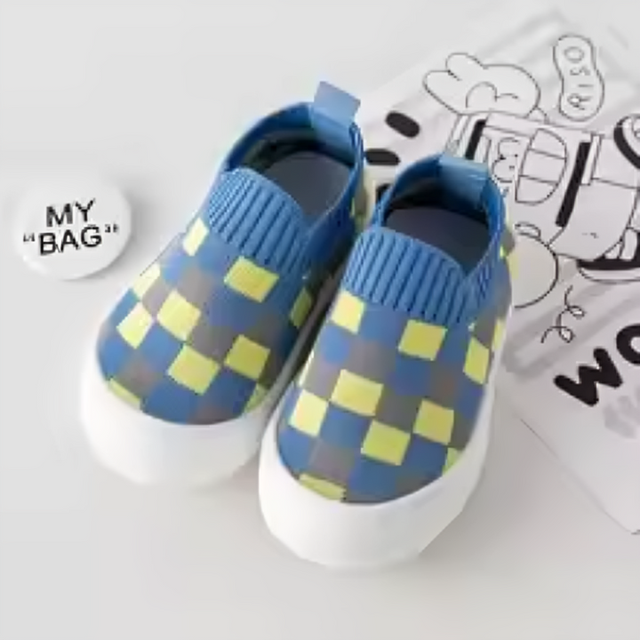 Pair of blue-yellow checkered slip-on shoes with blue heel tabs and white soles