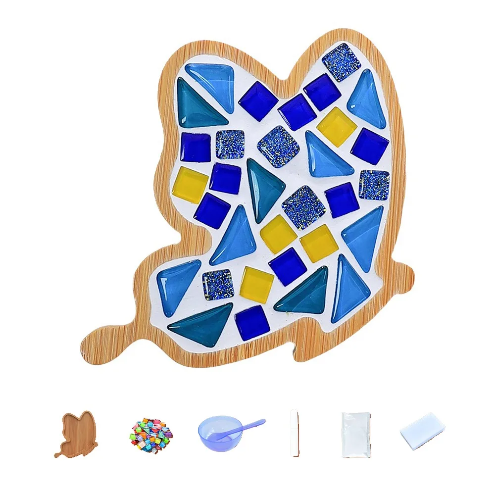 Blue and yellow mosaic coaster in a tall bamboo outline, shown with crafting supplies