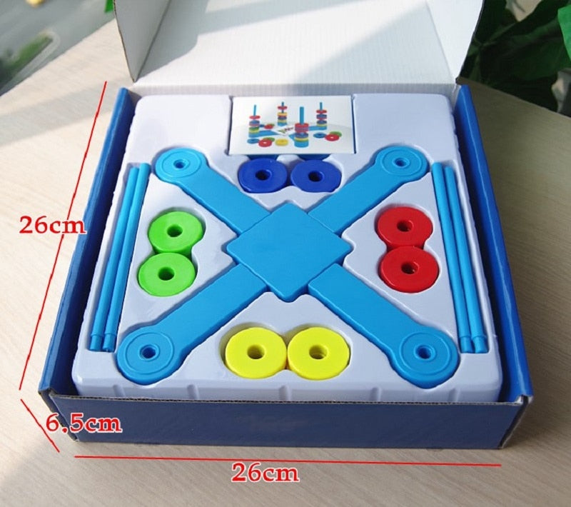 Boxed magnetic ring game in a fitted tray with labeled dimensions of 26 x 26 x 6.5 cm