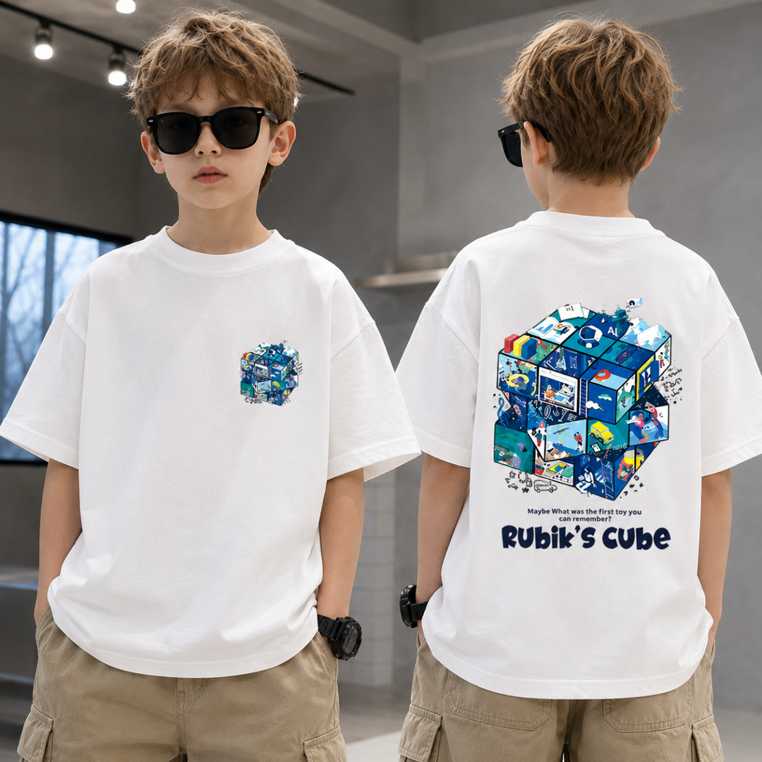 Boy wearing a white puzzle-cube T-shirt and beige shorts, shown from the front and back