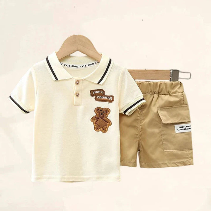 Cream polo shirt with bear detail beside beige cargo shorts