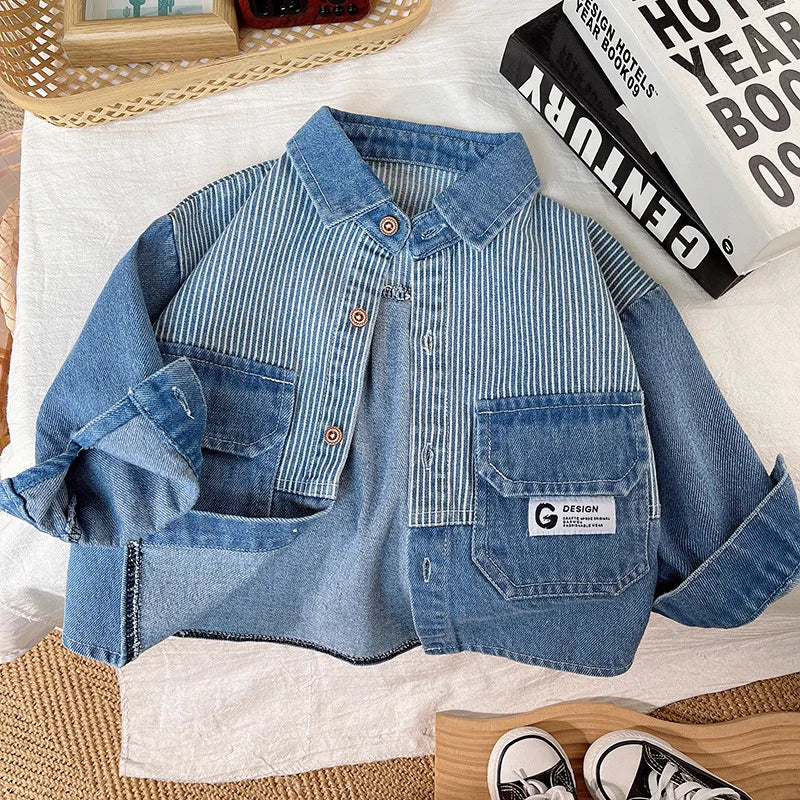 Flat lay of the button-front denim jacket with striped panels, blue patch pockets and turned-up sleeves.