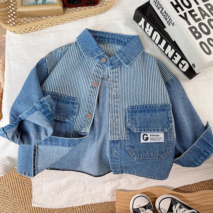 Flat lay of the button-front denim jacket with striped panels, blue patch pockets and turned-up sleeves.