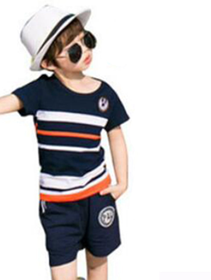Boy wearing a navy, white, and orange striped T-shirt with coordinating shorts