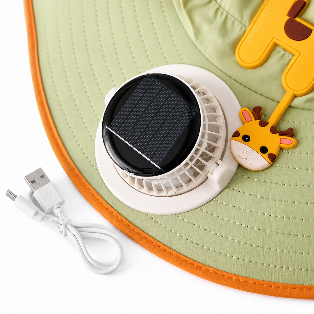 Close-up of a brim-mounted fan and solar panel on a green hat beside a USB charging cable.