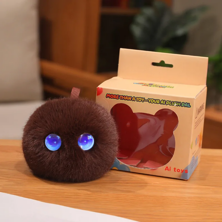 Brown AI plush toy with blue eyes and a hanging loop beside its box