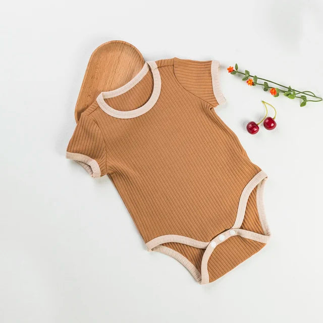 Brown short-sleeve baby romper with cream trim and a snap closure