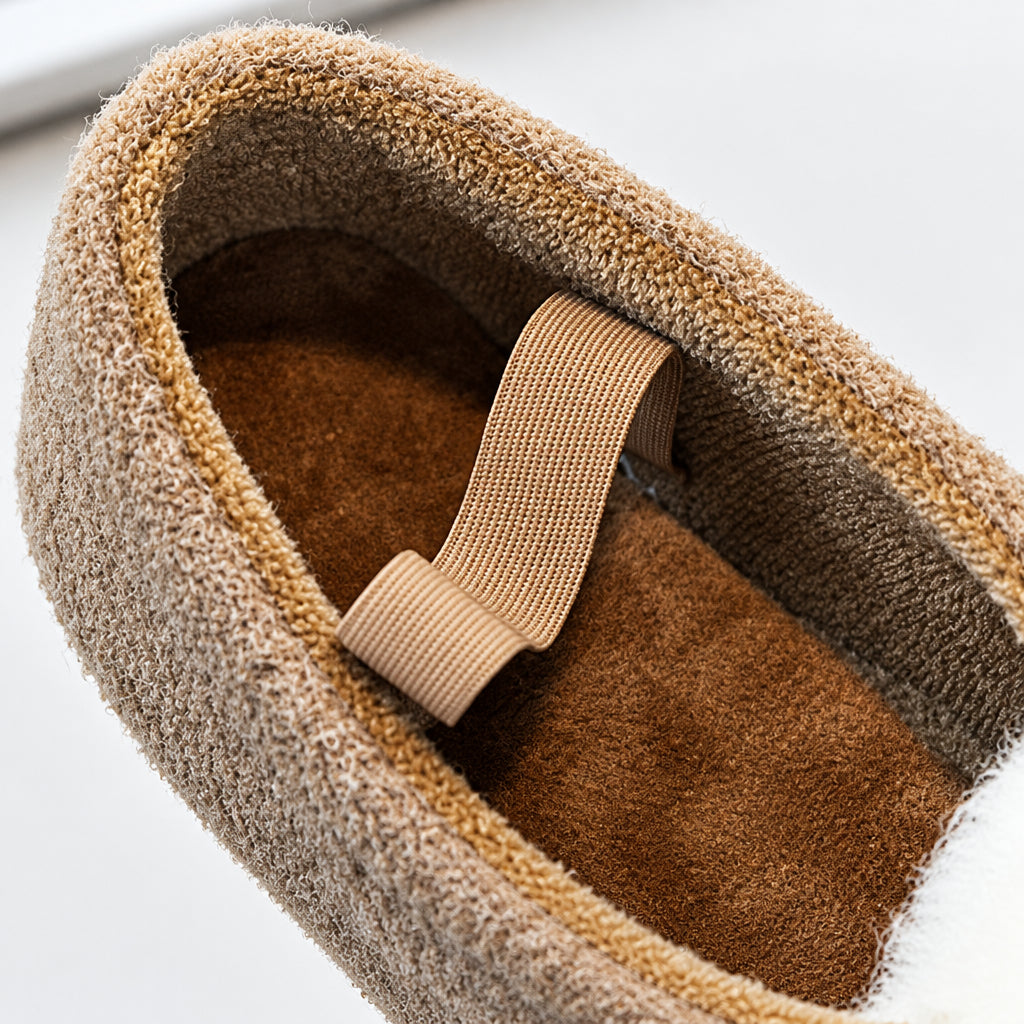 Close-up of the soft lining, insole and elastic strap inside a brown ballet flat