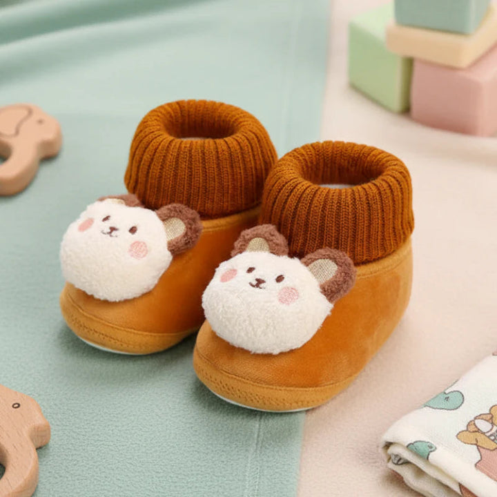 Brown bear baby slippers with plush faces and ribbed collars