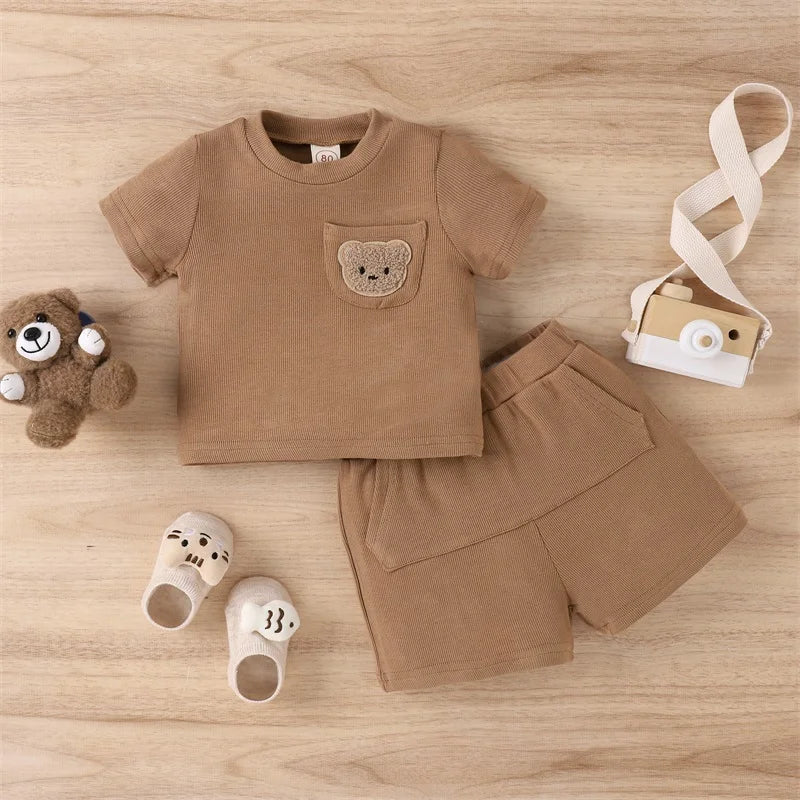 Brown bear-pocket T-shirt and coordinating shorts laid flat