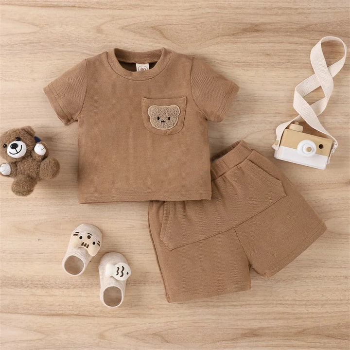 Brown bear-pocket T-shirt and coordinating shorts laid flat