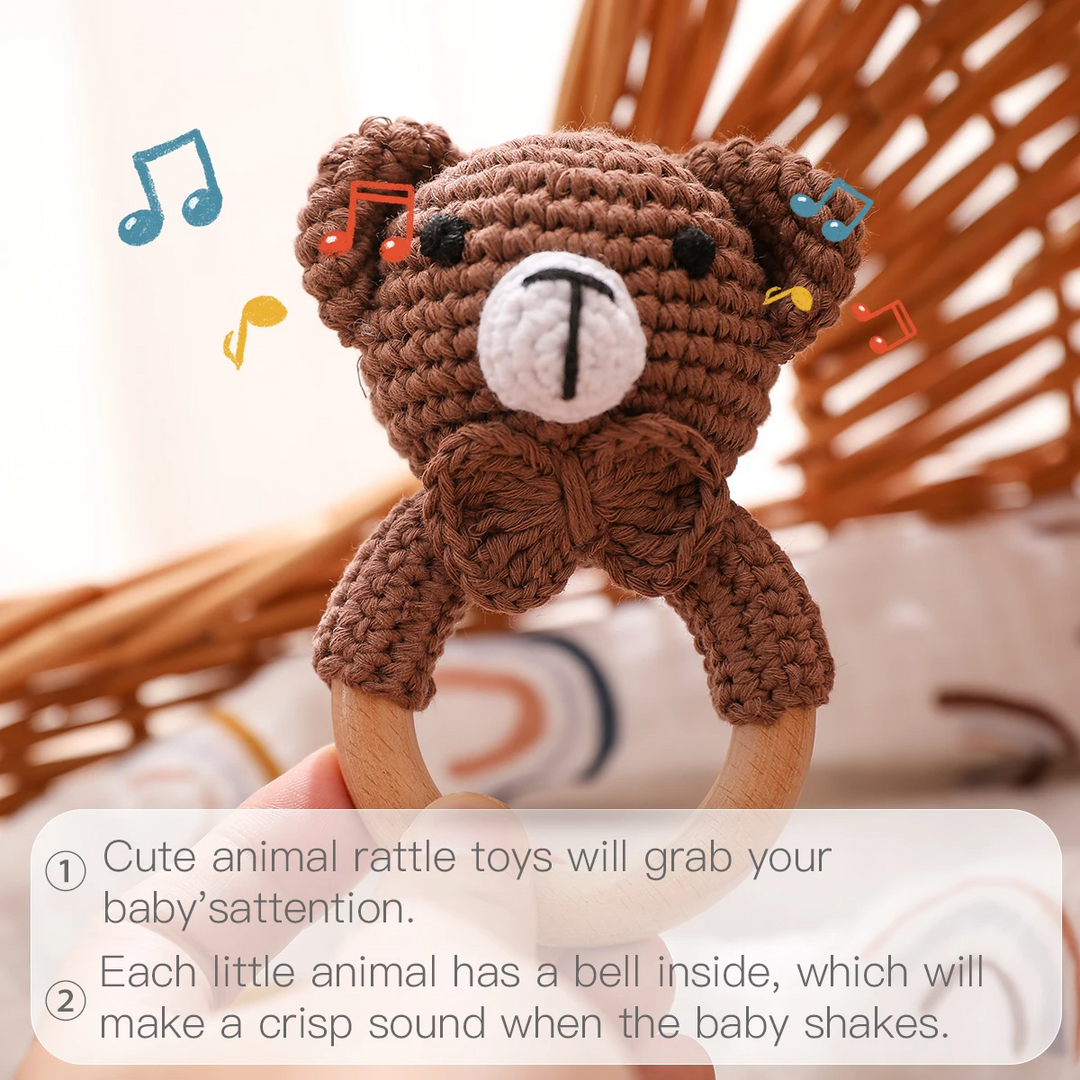 Brown bear wooden ring rattle with a graphic explaining the bell sound when shaken
