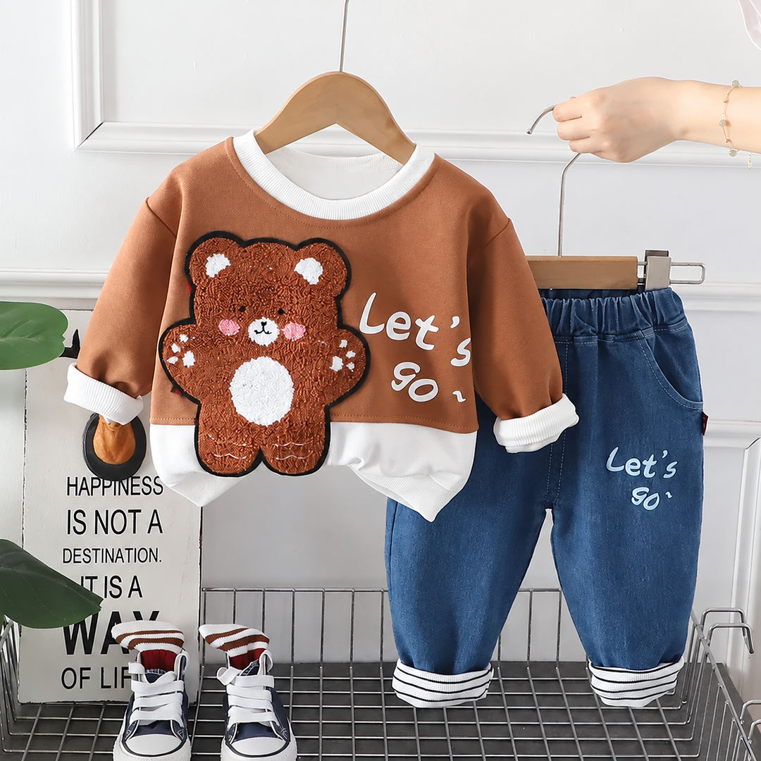 Brown bear sweatshirt and blue pants showing the animal design and white-trimmed neckline