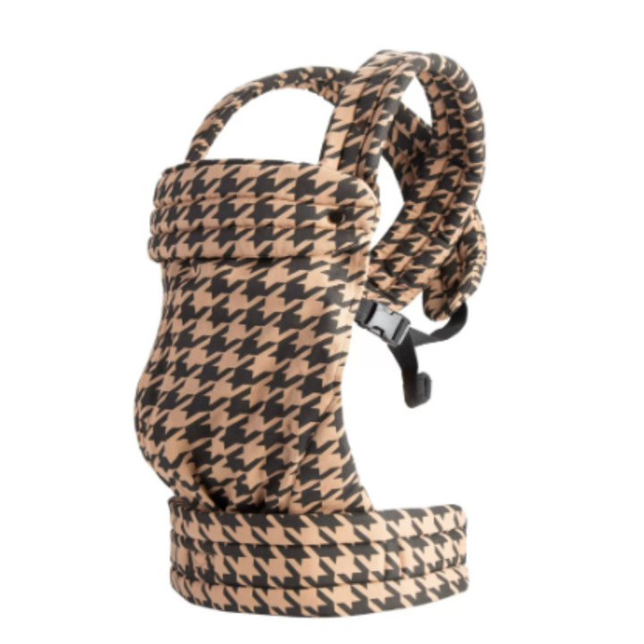 Brown-and-black houndstooth baby carrier with padded straps and front fastening buttons