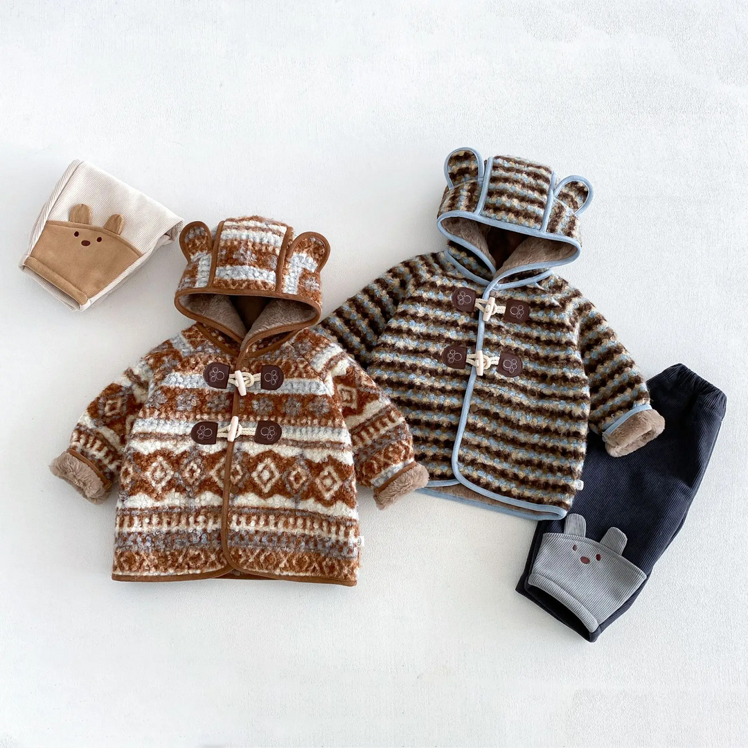 Brown and blue ear-hood winter jackets displayed with coordinating animal-detail pants