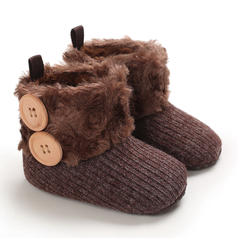 Brown baby boots with fluffy cuffs and two decorative buttons