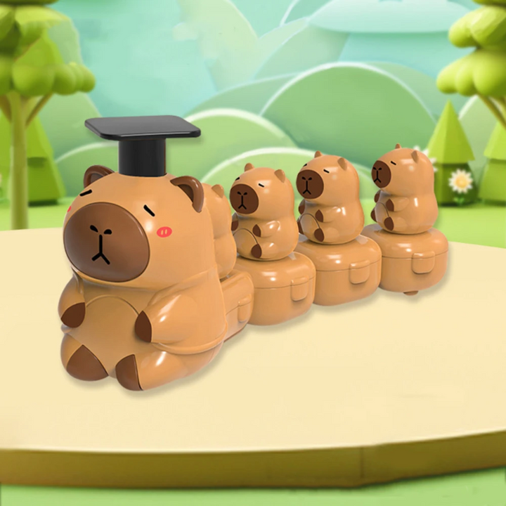 Brown capybara toy train with a black press-down top and smaller capybaras on trailing carriages