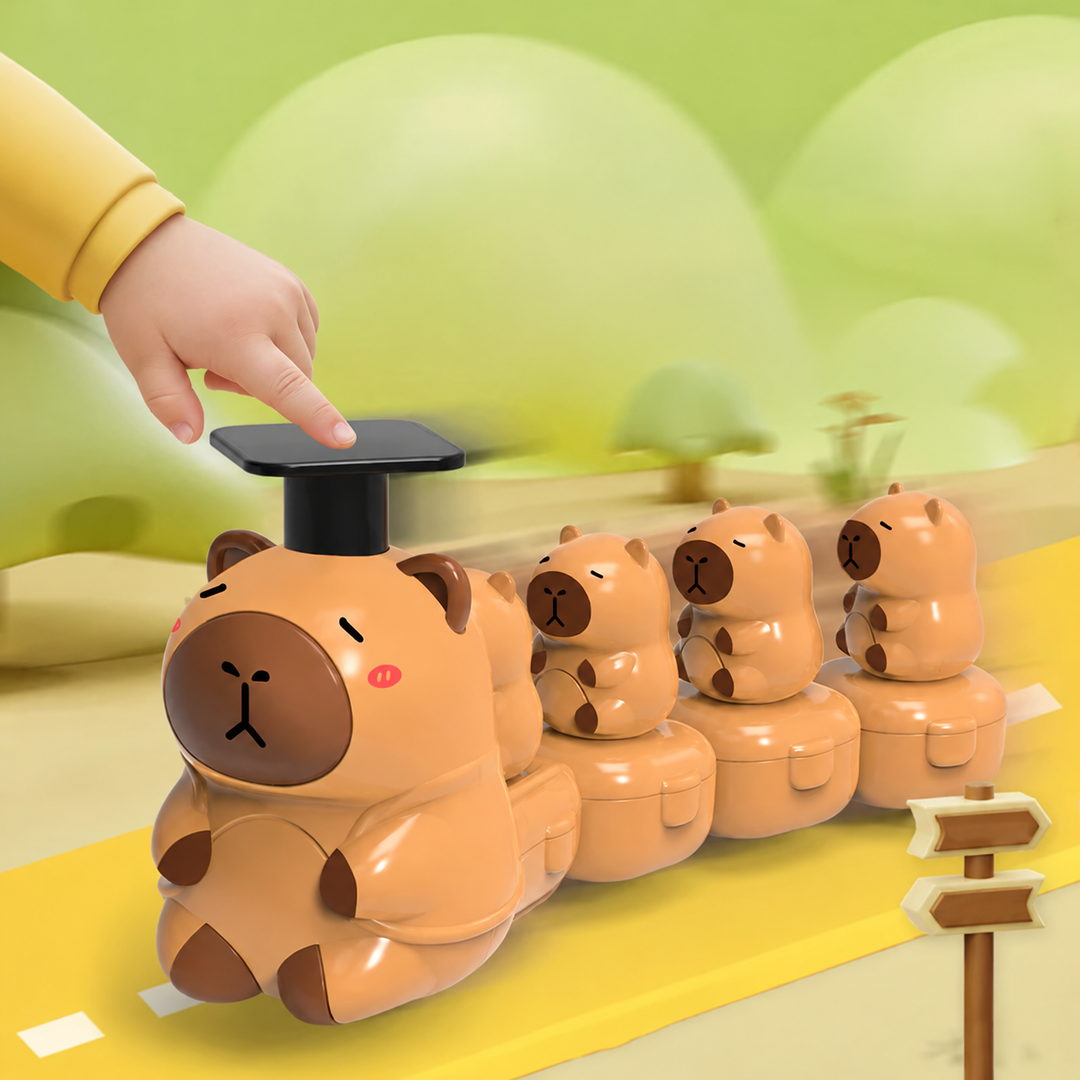 Hand pressing the black top of a brown capybara toy train with four small capybaras behind it