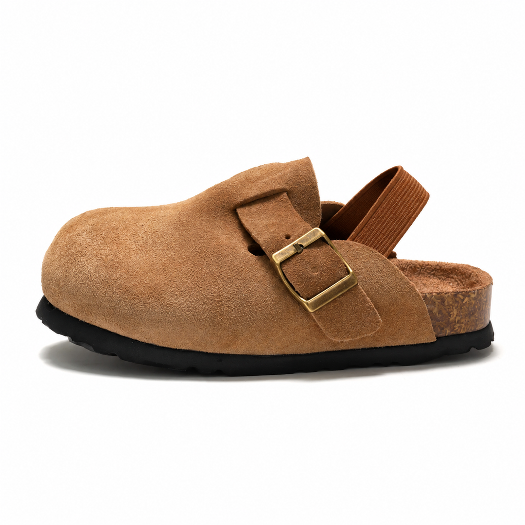 Brown clog sandal in side view with a buckle detail, elastic heel strap, and flat sole