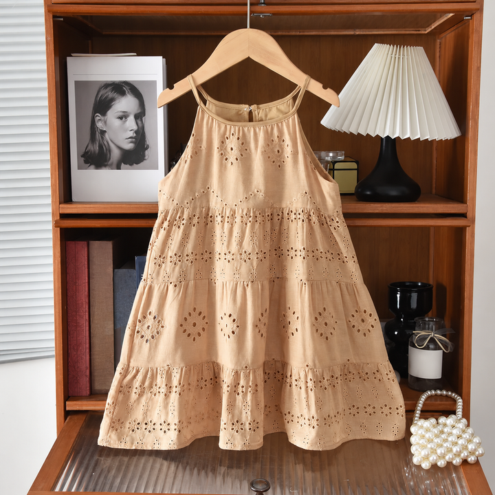 Full view of the brown cotton dress with slim straps and ruffled eyelet tiers