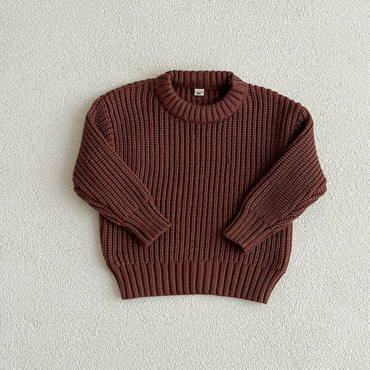 Brown cotton knit sweater with a round neckline, long sleeves, and ribbed cuffs and hem.