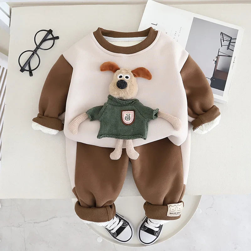 Brown sweater-and-pants set with a cream front panel and a plush puppy decoration