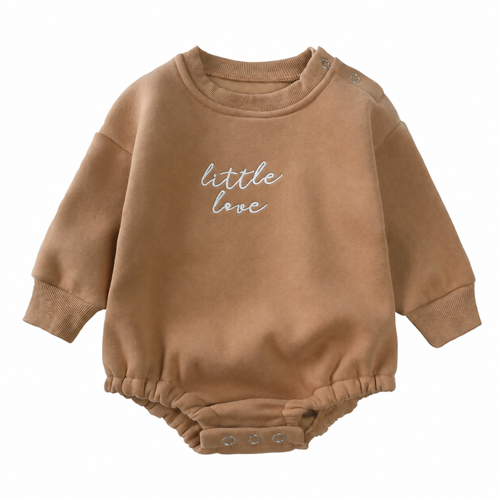 Brown cotton baby romper with ribbed cuffs, a round neck, and crotch snaps